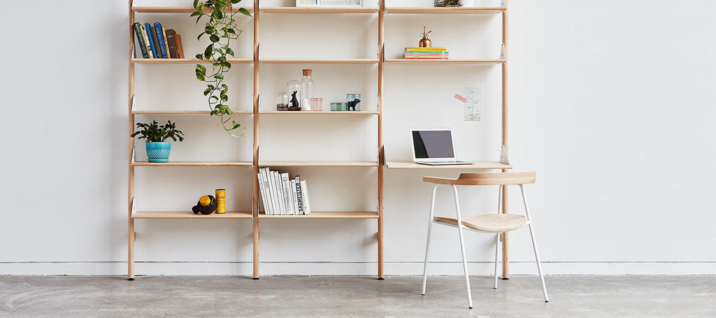 Gus* Modern Branch-1 Shelving Unit with Desk in a styled room setting