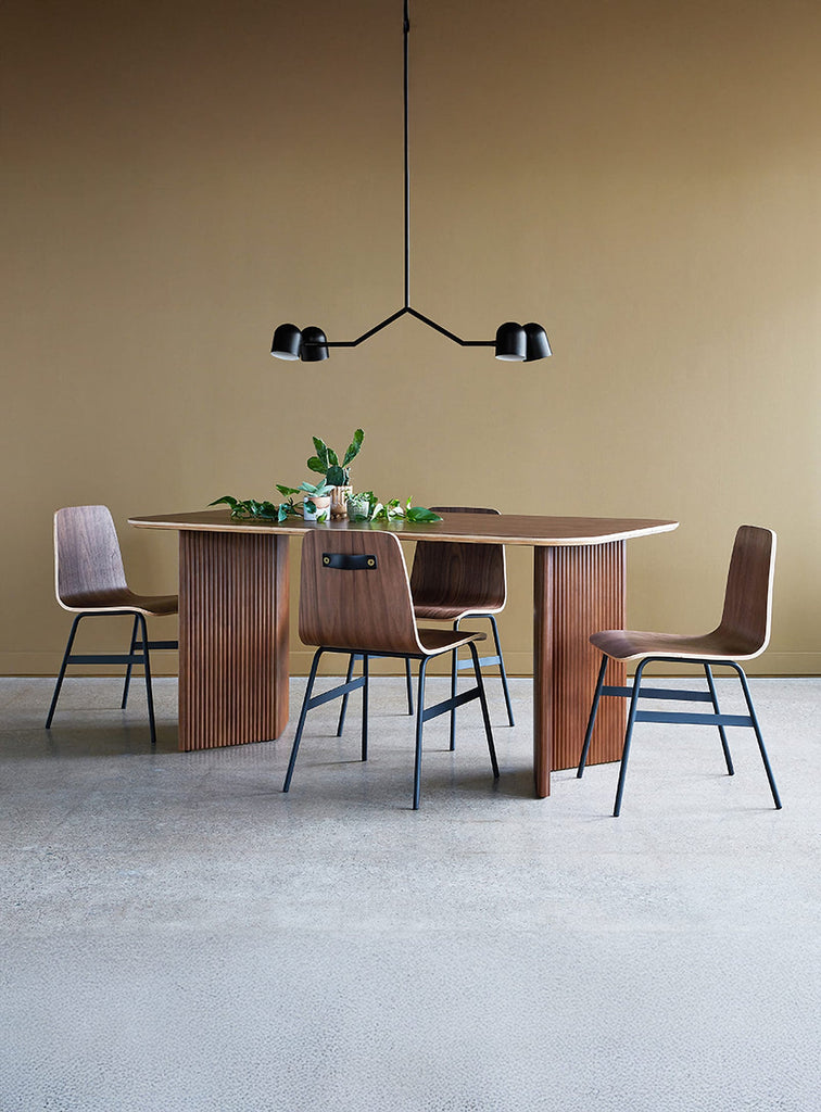 Gus* Modern Lecture Dining Chair in a styled room setting