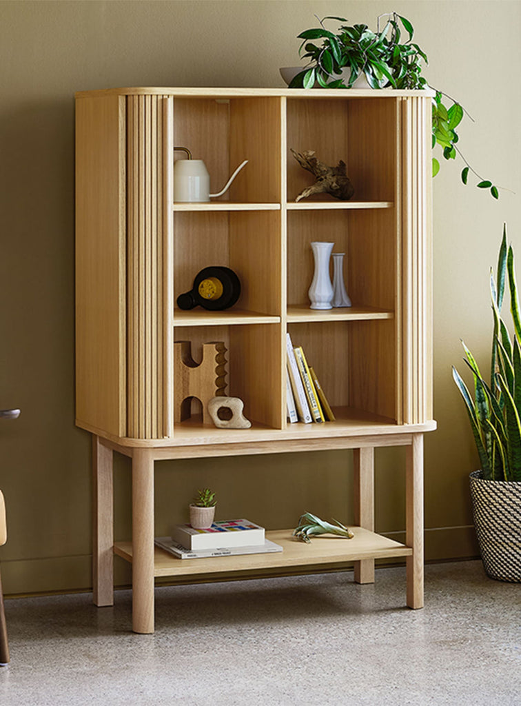 Gus* Modern Ledger Tall Cabinet in a styled room setting