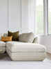 Gus* Modern Podium Ottoman in a styled room setting
