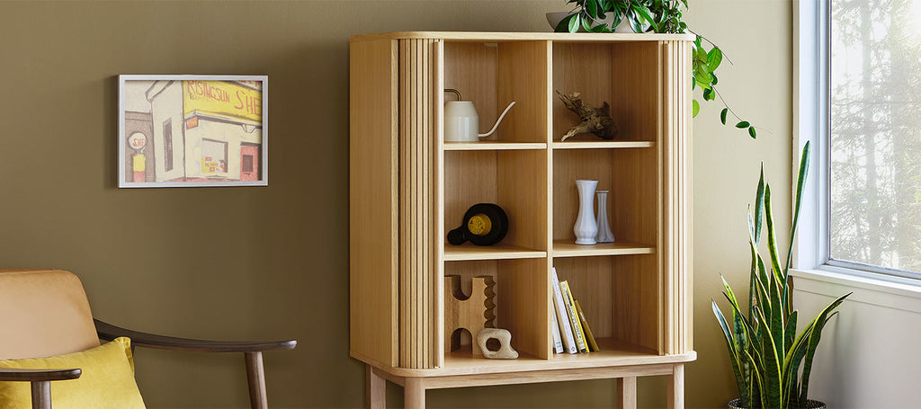 Gus* Modern Ledger Tall Cabinet in a styled room setting